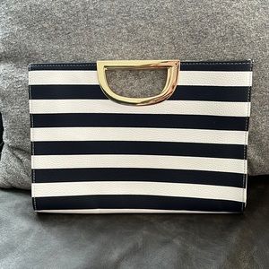 Nautical print clutch. Holds everything you need for a night out.
